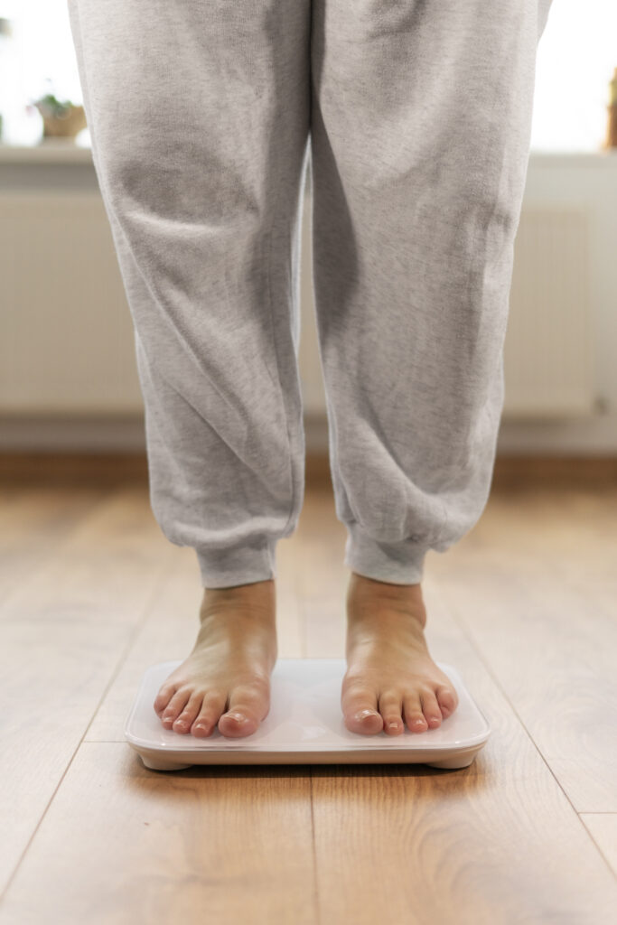 Person Standing On Weight Scale