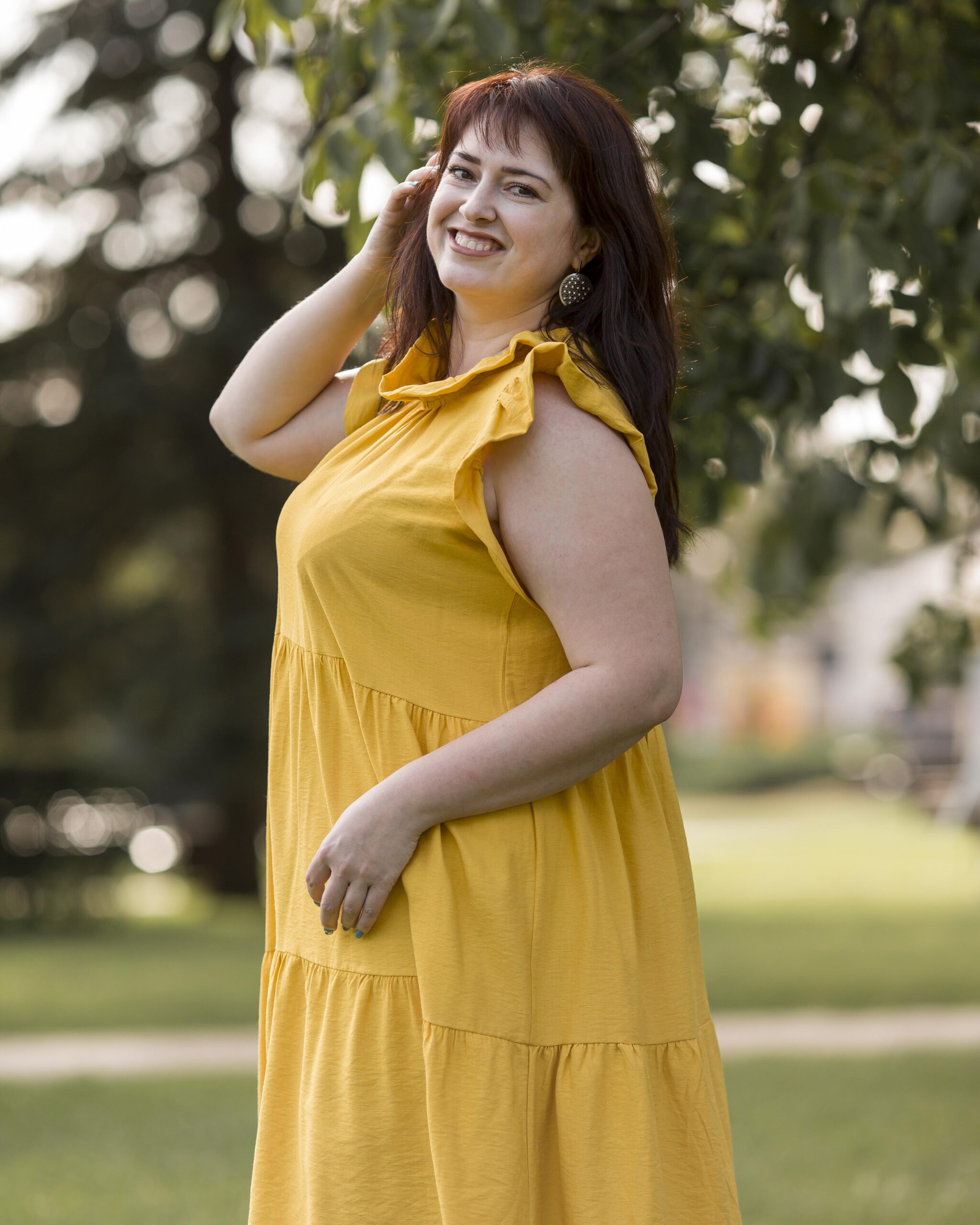 Woman Smiling Outdoors In A Park