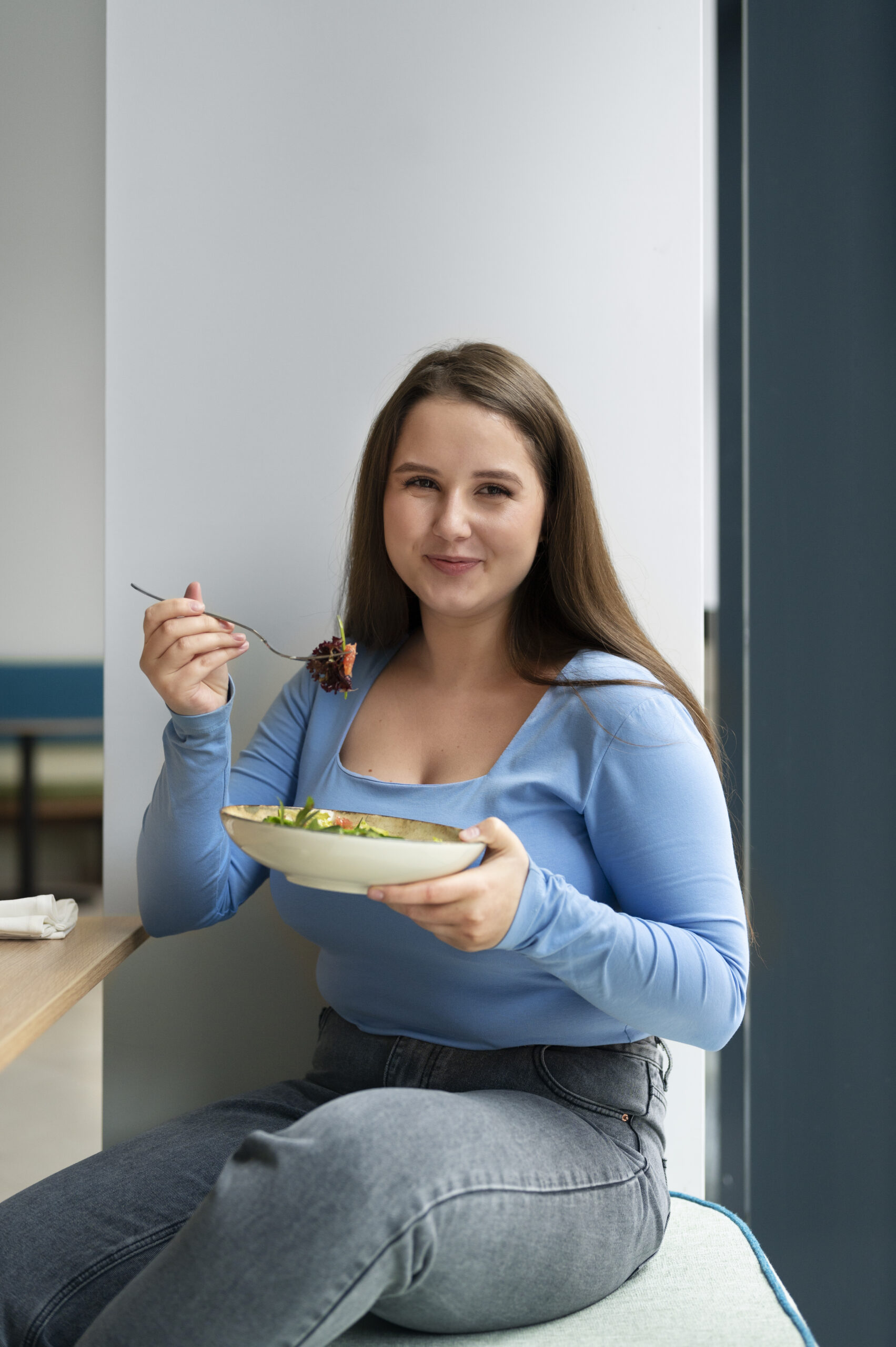 Women Eating A Bowl Of Salad
